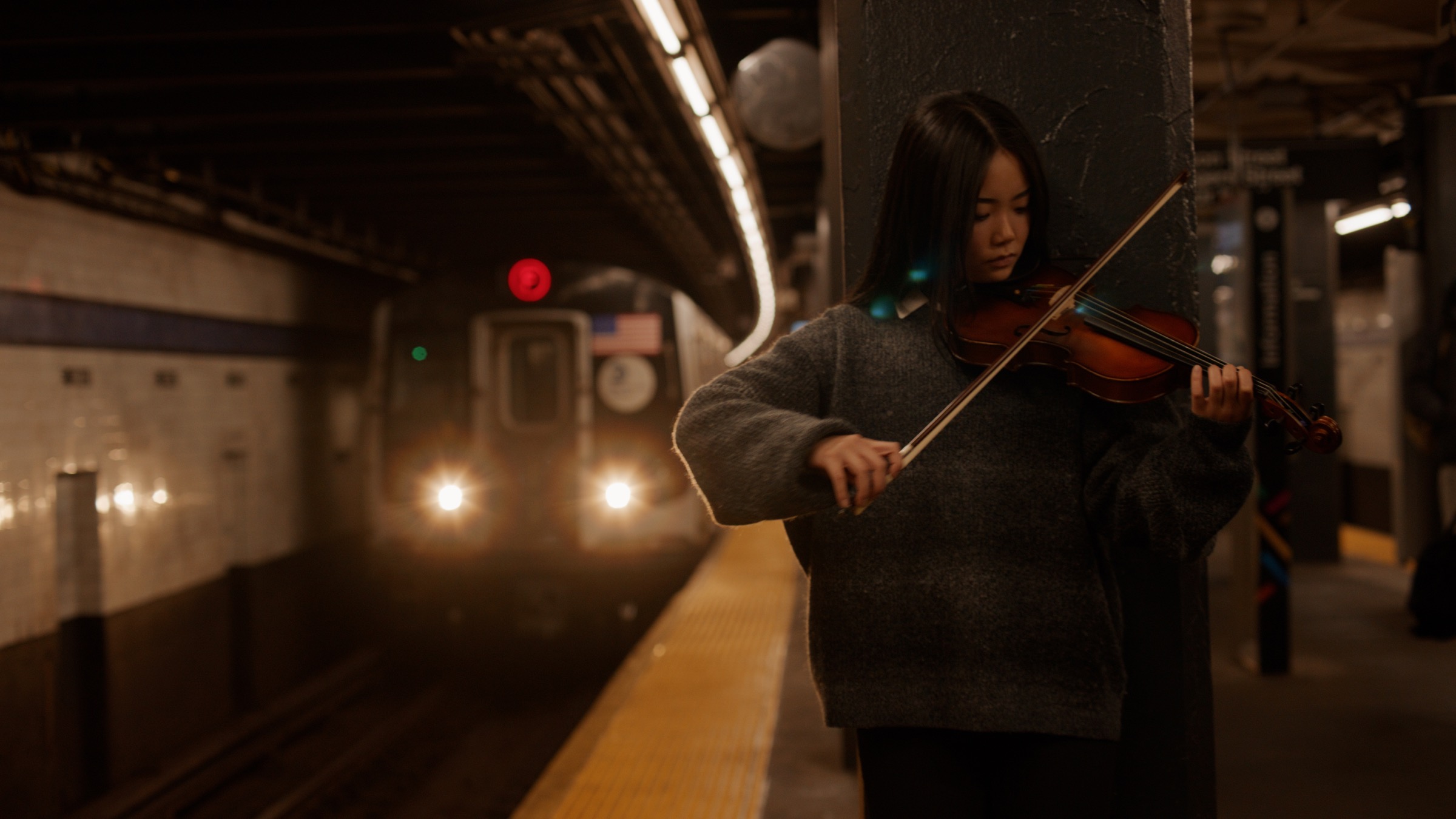 Concerto film still in subway station